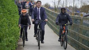 Connor Synott, Transport Minister Eamon Ryan and Tola Gahan cycle along a section of the Grand Canal Greenway between Sallins and Aylmer Bridge, CO Kildare, at the launch of Ireland's first National Cycle Network (NCN). Picture: Niall Carson/PA